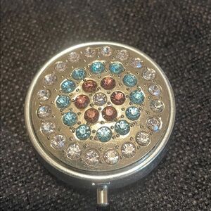 Assorted colors rhinestone pill case with three compartments.